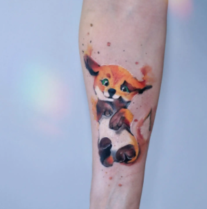 Adorable Watercolor Fox Tattoo on Forearm