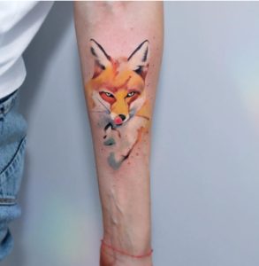 Beautiful Watercolor Fox Tattoo On Forearm