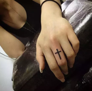 Cross tatto On Finger