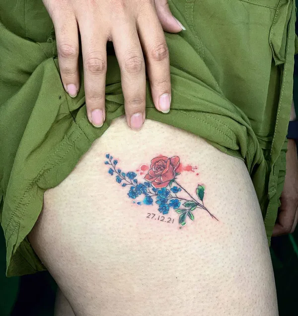 July birth Flower tattoo on thigh