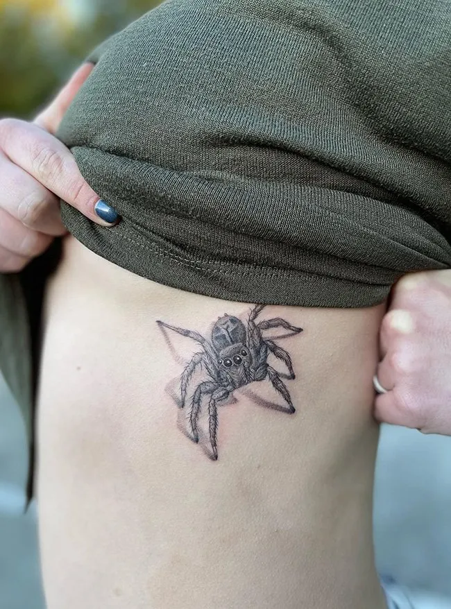 Spider tattoo on Ribs