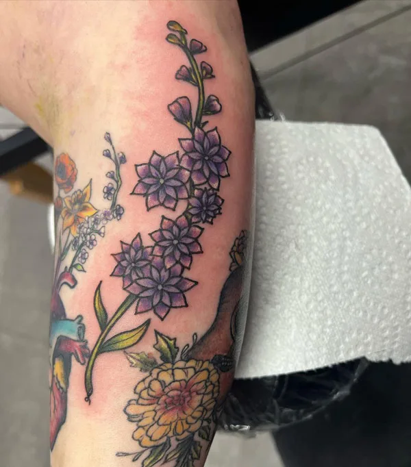 Conventional July birth flower tattoo