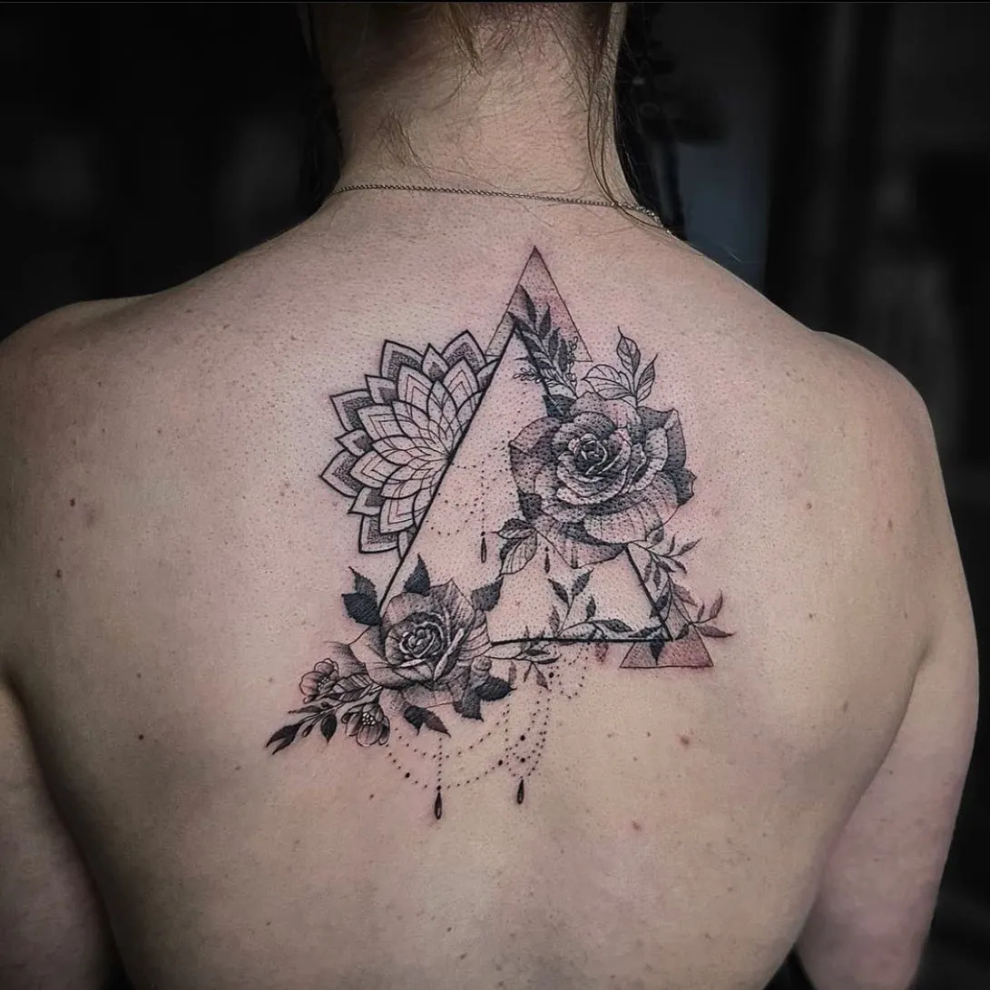Triangle tattoo with blooms and mandala